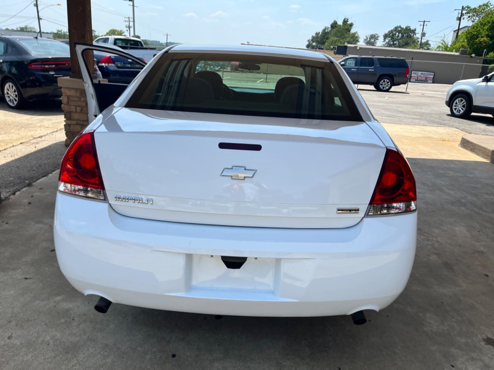 2012 White Chevrolet Impala LS (Fleet) (2G1WF5E31C1) with an 3.6L V6 DOHC 16V FFV engine, 6-Speed Automatic transmission, located at 307 West Marshall Avenue, Longview, TX, 75601, (903) 753-3091, 32.500828, -94.742577 - Photo #2