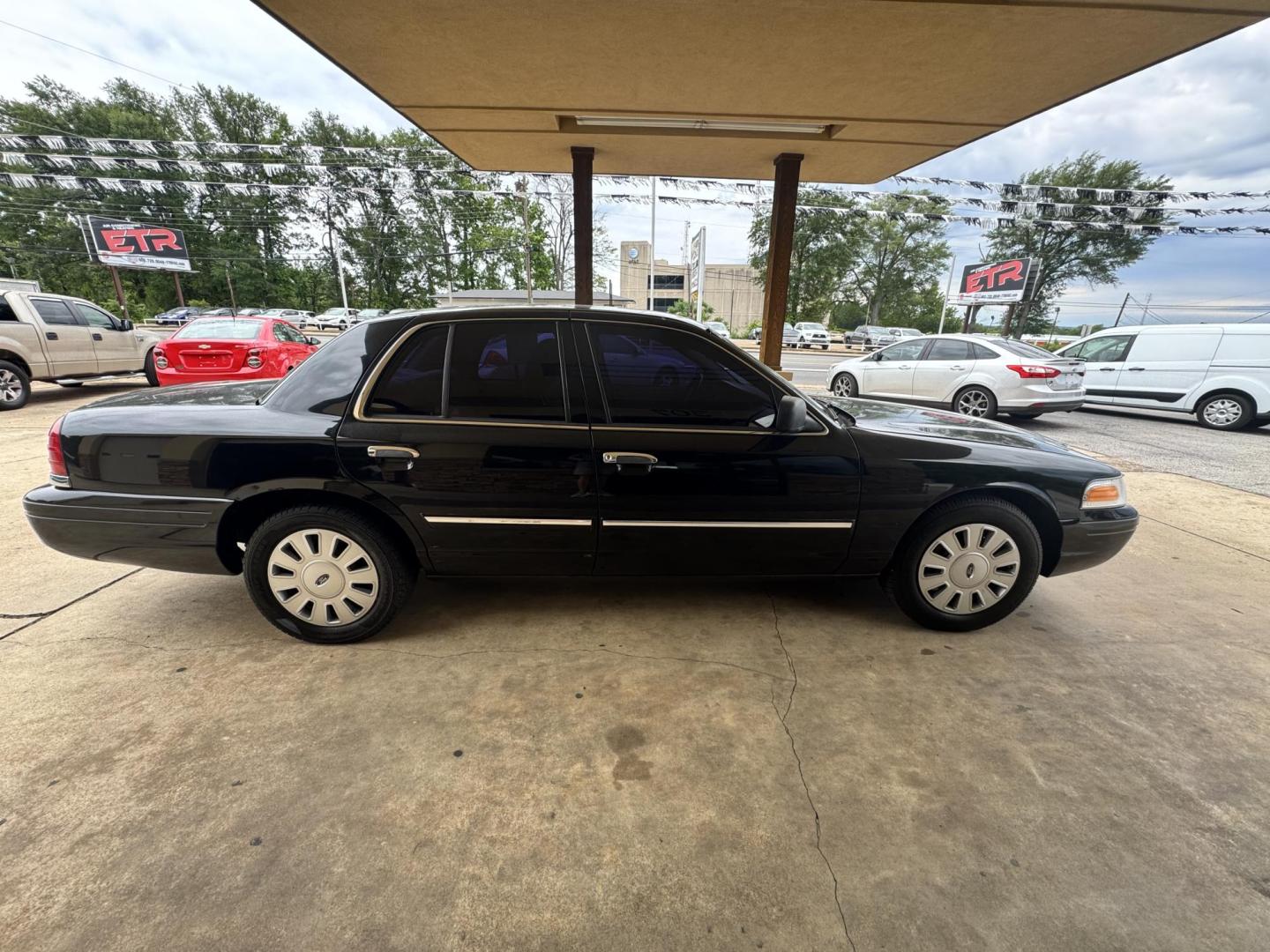 2011 BLACK Ford Crown Victoria Police Interceptor (2FABP7BV7BX) with an 4.6L V8 SOHC 16V FFV engine, 4-Speed Automatic transmission, located at 307 West Marshall Avenue, Longview, TX, 75601, (903) 753-3091, 32.500828, -94.742577 - Photo#2