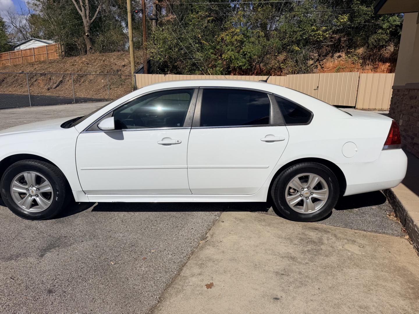 2014 WHITE Chevrolet Impala LS (2G1WA5E39E1) with an 3.6L V6 DOHC 16V FFV engine, 6-Speed Automatic transmission, located at 307 West Marshall Avenue, Longview, TX, 75601, (903) 753-3091, 32.500828, -94.742577- Photo#2